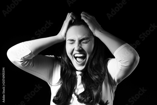 Screaming young woman on da...