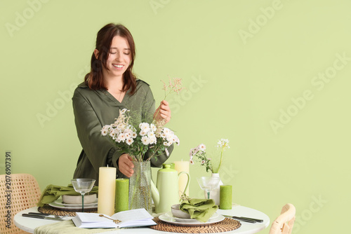 Pretty young woman serving ...