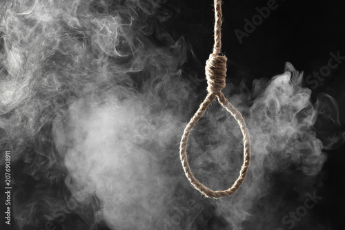 Valokuva Hanging rope with loop and smoke on dark background