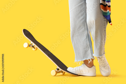 Young woman with skateboard...
