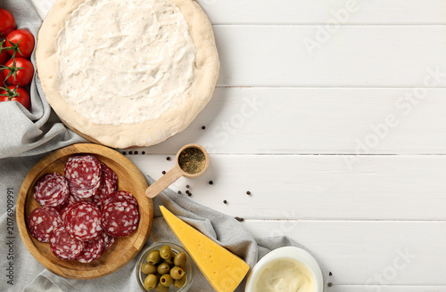 Pizza dough with tasty sauc...
