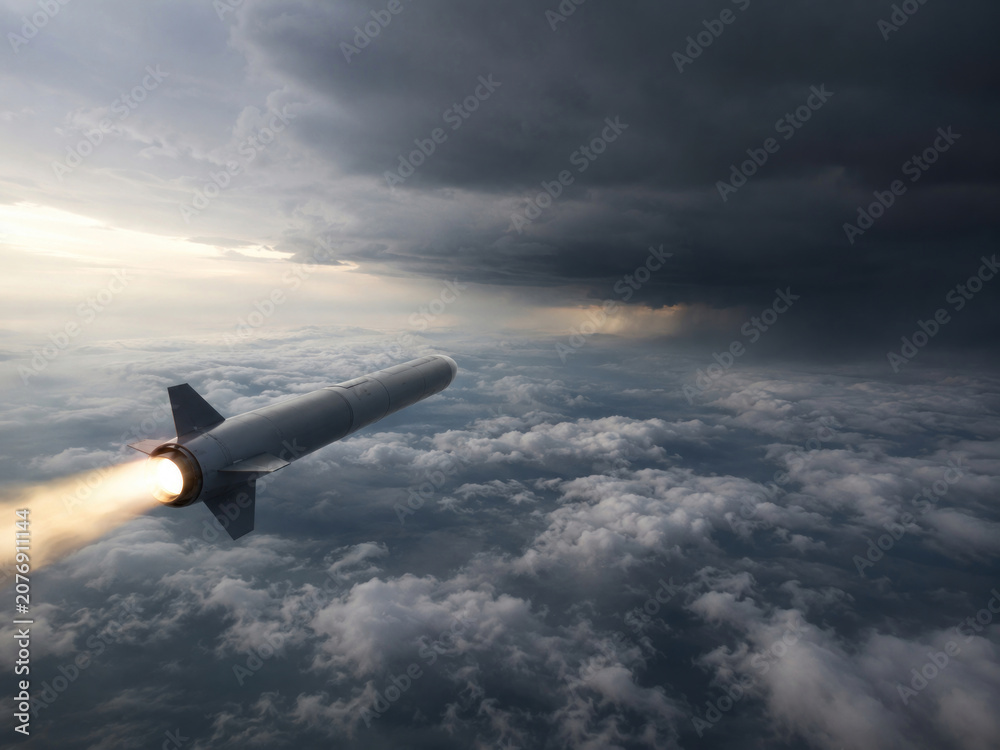Fototapeta premium Guided Missile Flying Above Clouds Toward Dark Storm Front