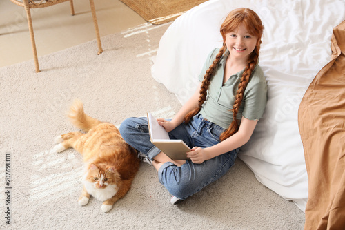 Teenage redhead girl with c...