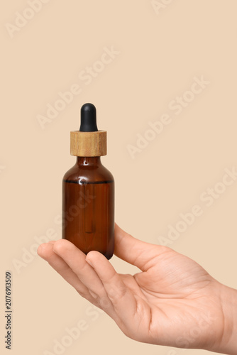 Female hand with bottle of ...