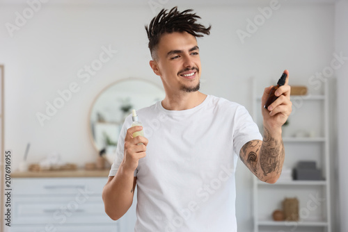 Young man with dreadlocks a...