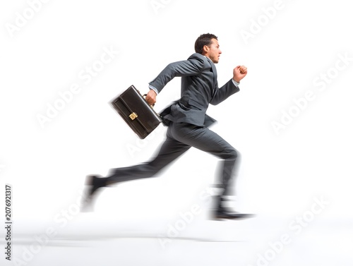 Man in suit running with briefcase.