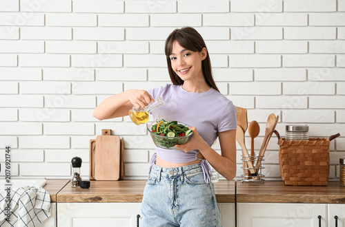 Young woman making fresh ve...