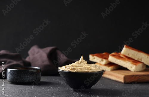 Bowl of delicious hummus on...