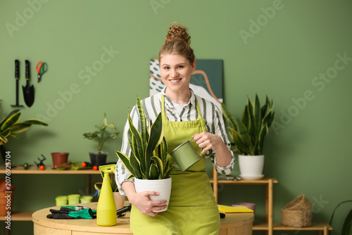Pretty young woman in apron...