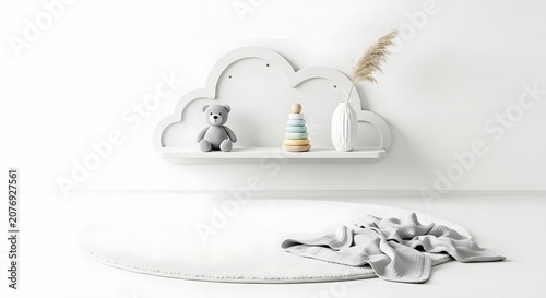 Minimalist nursery decor with a white cloud shelf, teddy bear, wooden toy, and round rug on a bright floor.