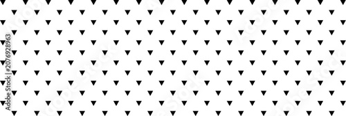 Schilderij op canvas Seamless pattern of small black inverted triangles arranged in a precise geometr