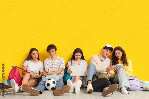 Group of teenage students u...