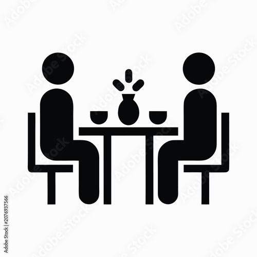  Two people dining at a table with wine glasses
