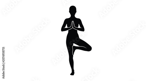 Black silhouette of a female figure performing the tree yoga pose with hands pressed together in a prayer position against a plain white background surface