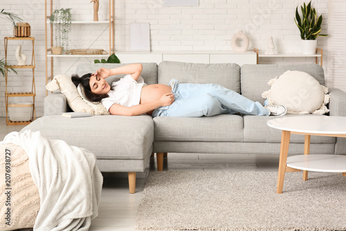 Beautiful pregnant woman ly...