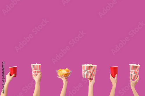 Hands holding buckets with ...