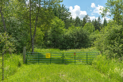 Country Property with Cattle Gate and No Trespassing Signs