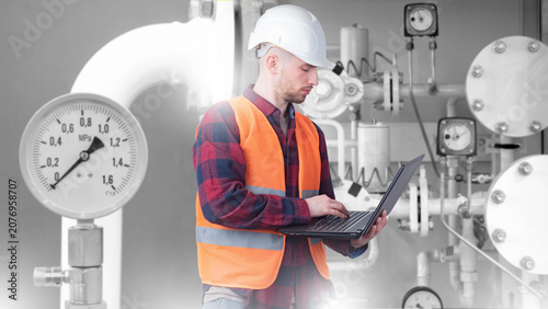 Konstfotografi Industrial plant maintenance engineer checks pipeline pressure systems using lap