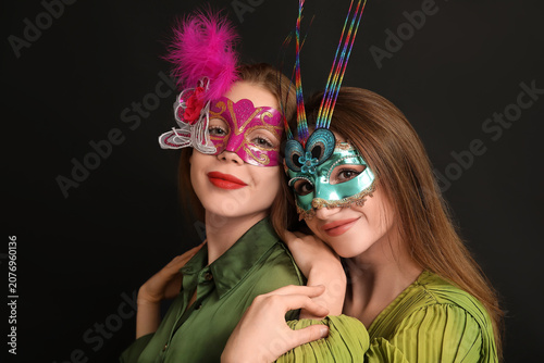 Happy young women in carniv...