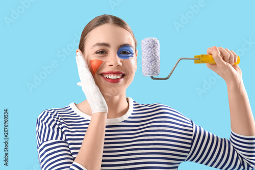 Young woman with painted fa...