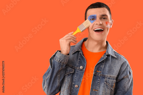 Young man with painted face...