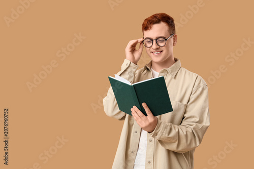 Young man in eyeglasses rea...