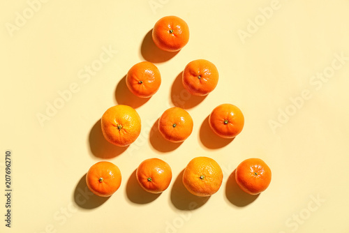 Many sweet mandarins on yel...