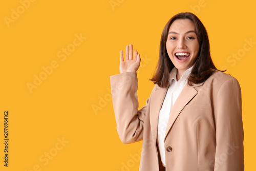 Beautiful woman waving hand...