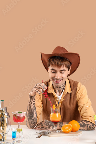 Young male bartender dresse...