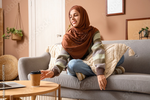 Young Muslim woman taking c...