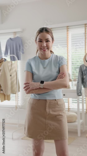 Young adult asia woman people smile look at camera work happy old used heap shirt sale online second hand sell thrift store. Go green eco fabric reduce zero waste issue side hustle small home shop.