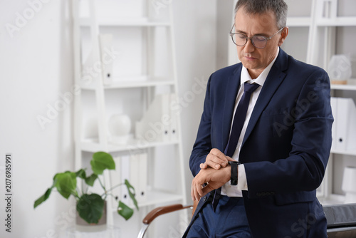 Mature businessman looking ...