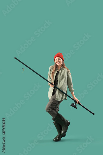 Happy young woman with fish...