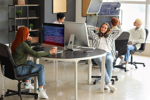 Team of young programmers w...