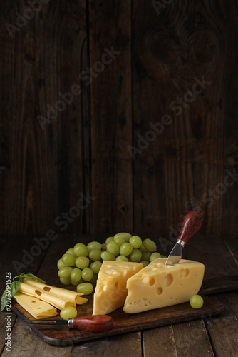 Board with tasty Swiss chee...