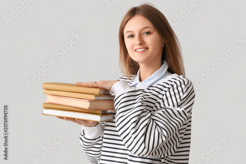Happy female student with s...
