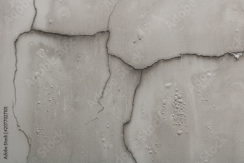Tableau sur toile A weathered, damaged concrete wall surface