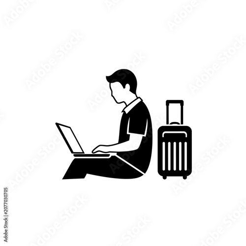 Man working on laptop next to suitcase, remote work, travel concept