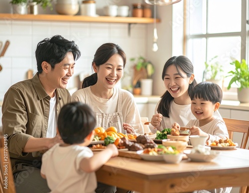 happy Asian family enjoying breakfast