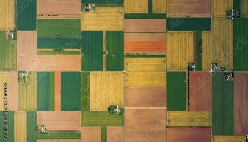 Aerial Patchwork Fields of Green and Yellow Farmland.