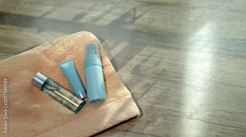 Fotografie Minimalist Skincare Set on Soft Towel