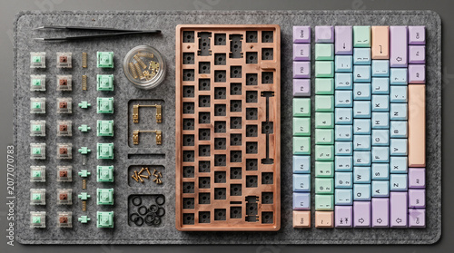 Custom mechanical keyboard components arranged for assembly on a desk mat with keyboard, mechanical