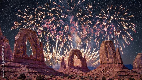 Fireworks illuminate Arches National Park on USA Independence Day night