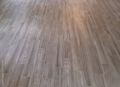 Tile Flooring Background in Staggered Pattern with Natural Wood‑Grain Texture