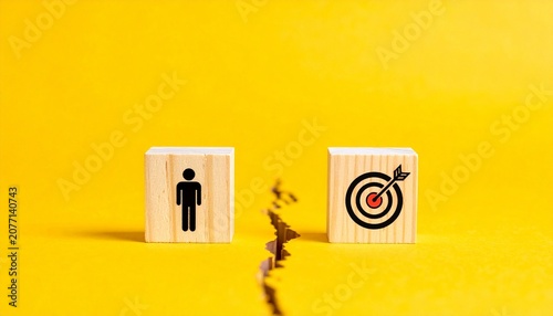 Person block separated from target block by cracked yellow surface