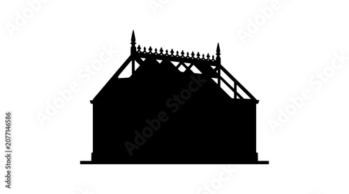 Silhouette of a Victorian building with ornate roof cresting