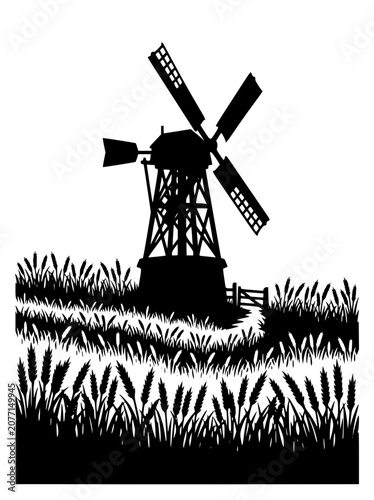 Traditional windmill silhouette in a rural wheat field landscape