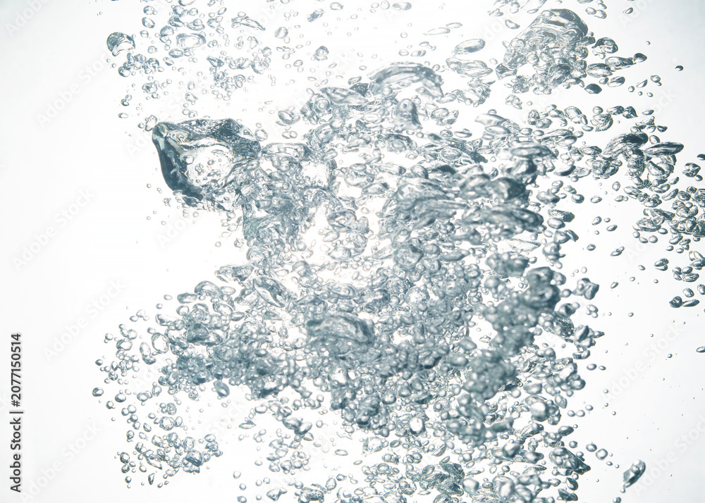 Fototapeta premium Splashing water, oxygen relaxation. air bubbles float up in clear water. pure drinking water, clean and clear water textured on white background