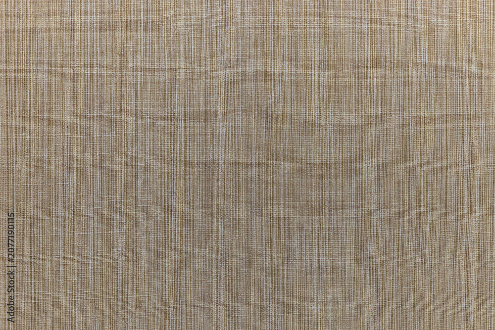 Fototapeta premium Beige fabric texture with vertical weave pattern