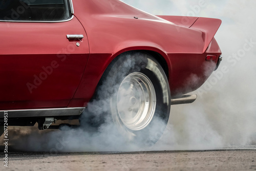 Vintage racing car warming up tires 